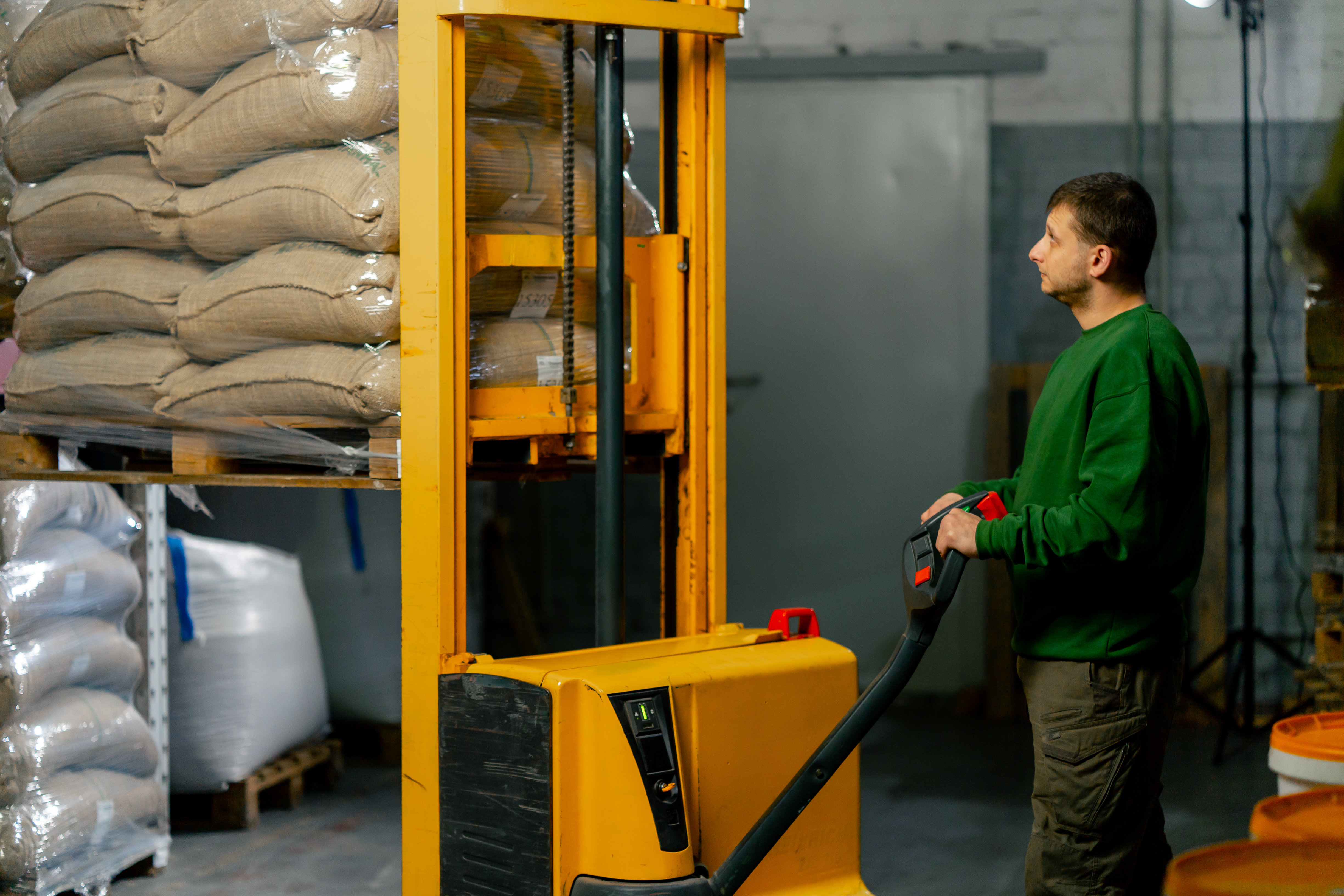 a-worker-at-coffee-factory-uses-a-yellow-forklift-2026-01-06-08-48-44-utc